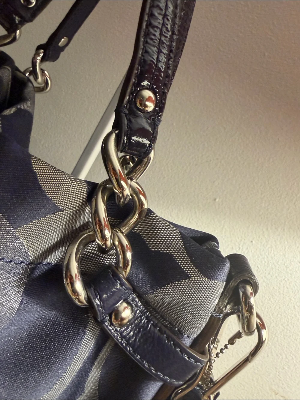 Coach navy , gray & metallic silver signature jacquard with navy leather trim.